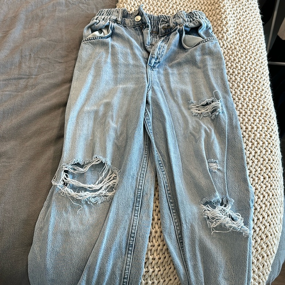 All saints jeans, ripped jeans style.